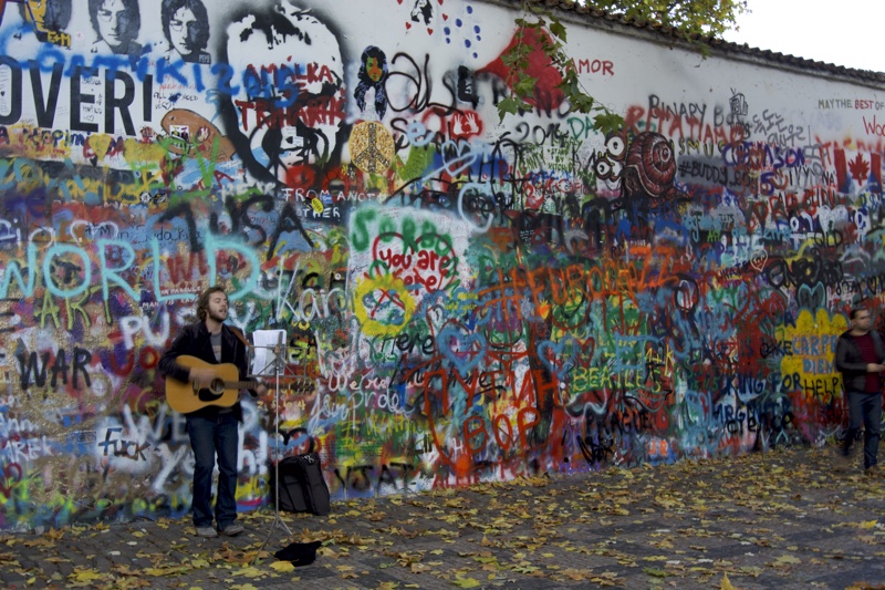 Busker by John Lennon's Wall